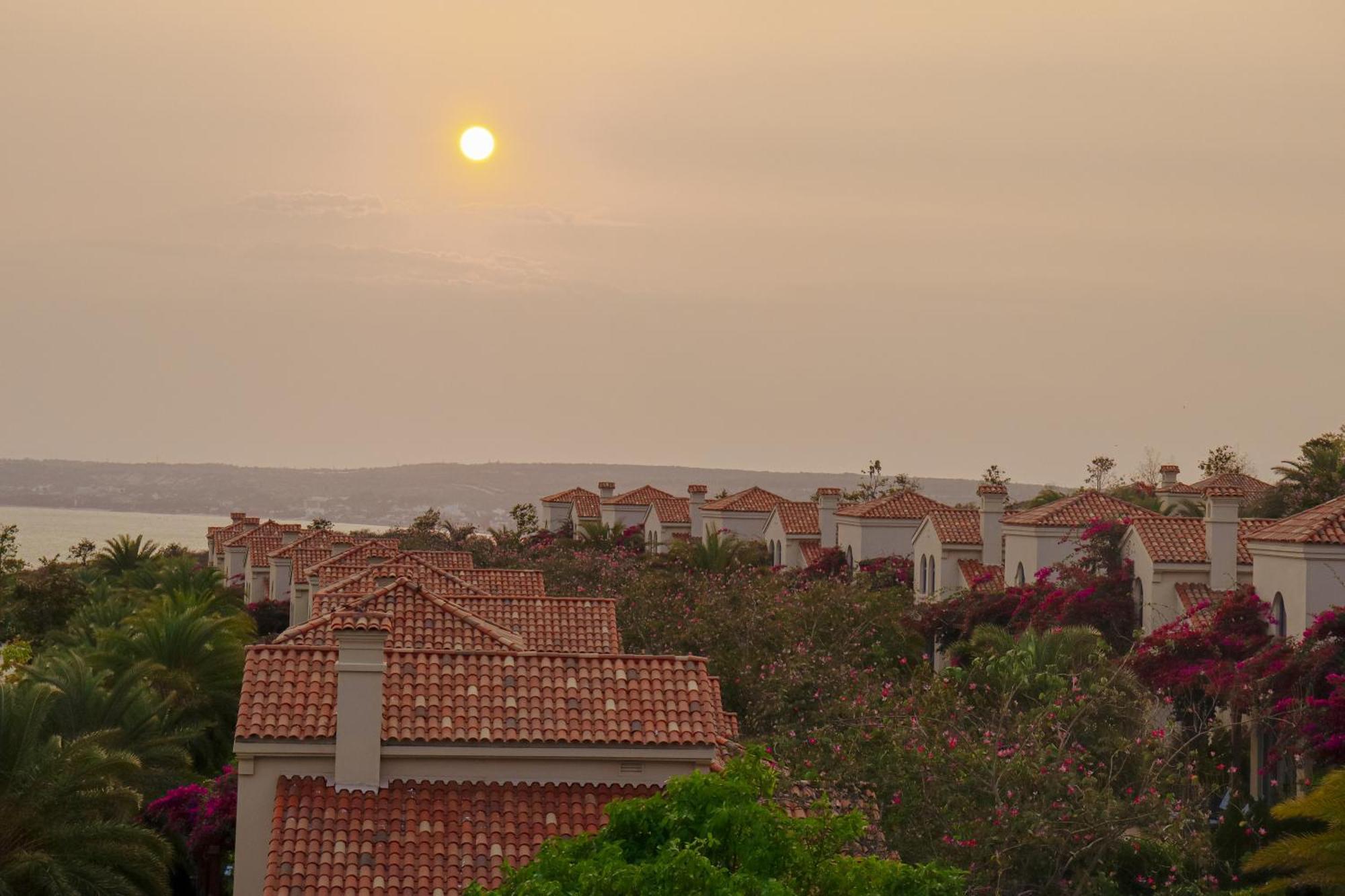 Centara Mirage Resort Mui Ne Exterior photo Sunset over the town